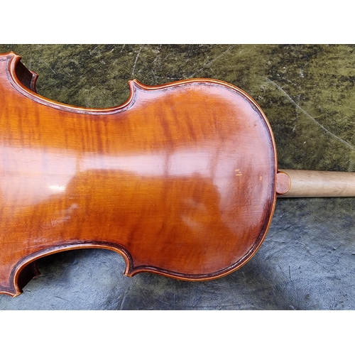 1572 - A violin, with 14in two piece back; together with bow. 