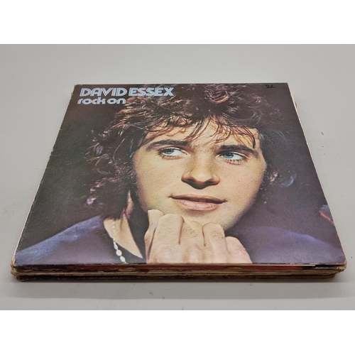 1573 - A small quantity of 33rpm vinyl records, to include the Beatles, David Bowie, and David Essex. ... 