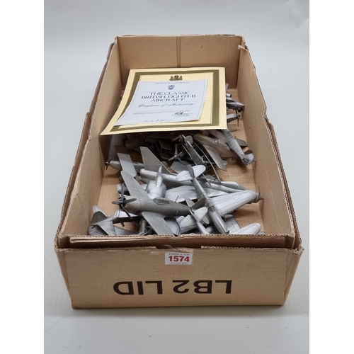 1574 - Twenty-one pewter aeroplanes, the wingspan of largest, 22cm. 