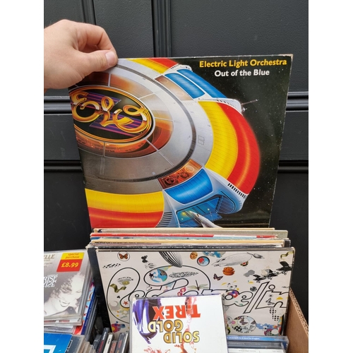 1580 - A collection of 33rpm and 45rpm vinyl records; to include Led Zeppelin, Motohead and ELO; together w... 