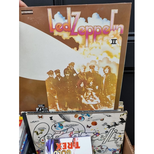 1580 - A collection of 33rpm and 45rpm vinyl records; to include Led Zeppelin, Motohead and ELO; together w... 