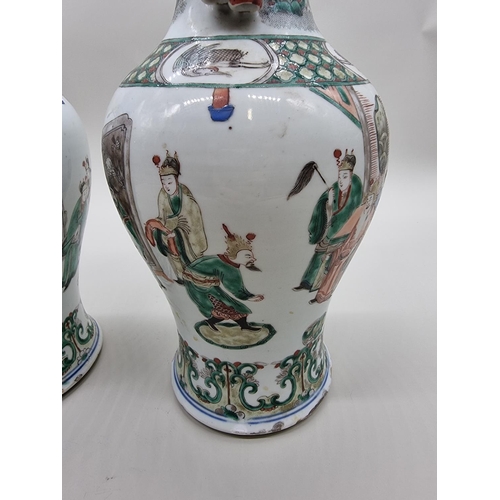 1602 - A large pair of Chinese famille verte twin handled vases, Qing, 36cm high, (s.d).