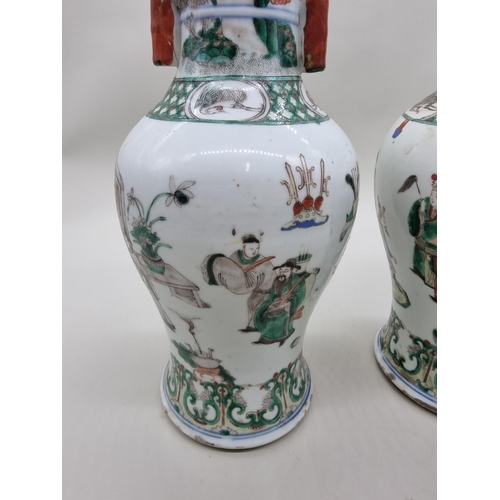 1602 - A large pair of Chinese famille verte twin handled vases, Qing, 36cm high, (s.d).