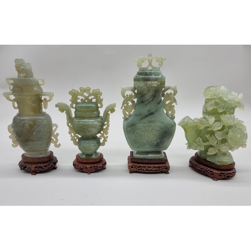 1604 - Three Chinese carved green jade twin handled vases and covers, 22cm high; together with another... 