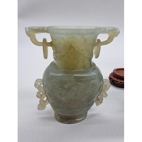 1604 - Three Chinese carved green jade twin handled vases and covers, 22cm high; together with another... 