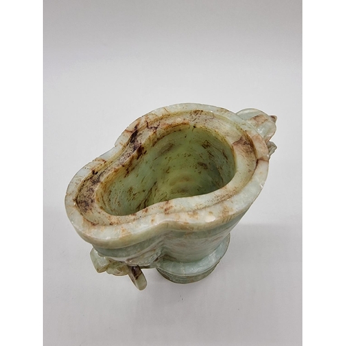 1605 - A Chinese Archaistic style carved green and russet jade ewer and cover, 22cm high, (chips to co... 