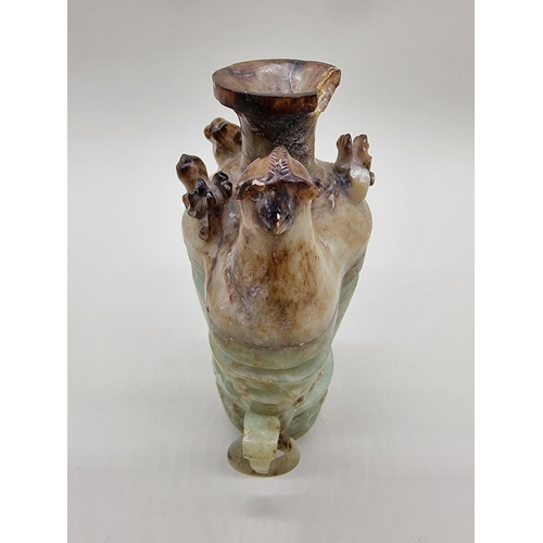 1605 - A Chinese Archaistic style carved green and russet jade ewer and cover, 22cm high, (chips to co... 