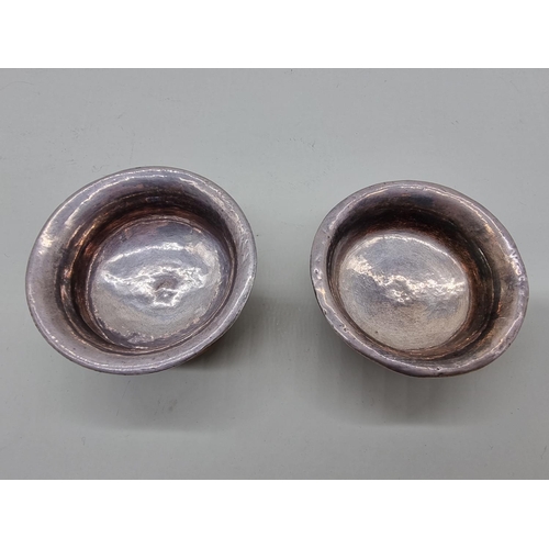 1606 - A small pair of burr wood and white metal mounted bowls, 7cm diameter. 