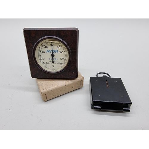 1613 - A brown Bakelite 'Avon Tyres' barometer; together with a military compass. (2)