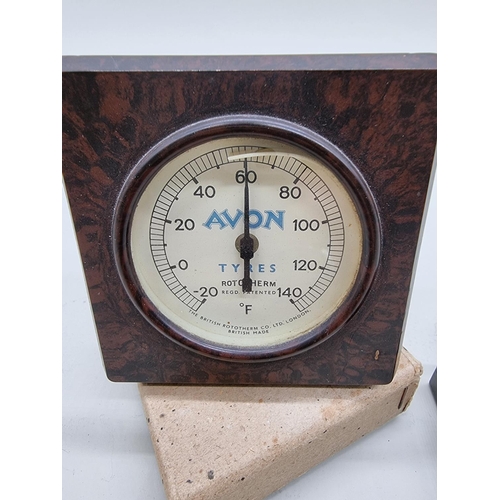 1613 - A brown Bakelite 'Avon Tyres' barometer; together with a military compass. (2)