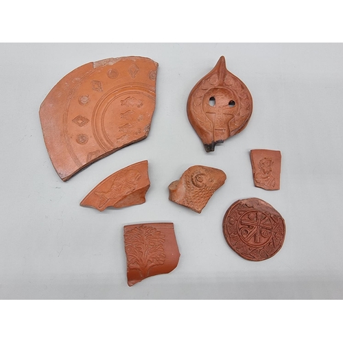 1615 - Antiquities: a group of Tunisian pottery shards, probably circa 3rd century AD, each with Christian ... 