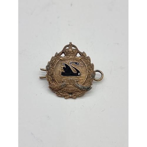 1639 - A World War I Australian 10th Light Horse Regiment brass and black enamel cap badge, marked J R Gaun... 