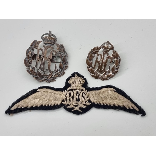 1652 - A World War I RFC pilot's cloth wings badge, 110mm; together with two similar badges. (3)... 