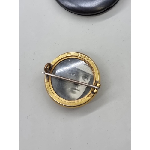 1653 - A World War I Royal Army Medical Corps brass button, converted to pin badge with inset portrait phot... 