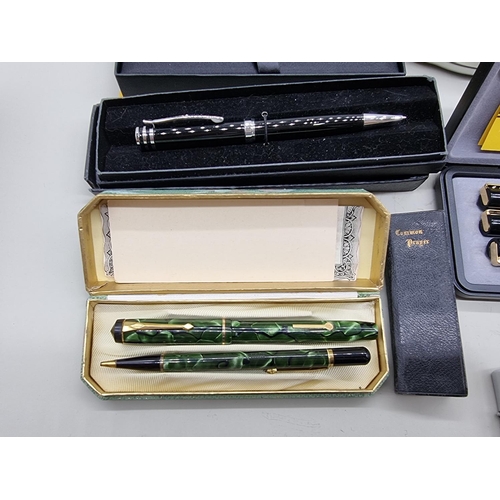 1658 - A collection of vintage pens and lighters, to include a boxed Conway Stewart set. ... 