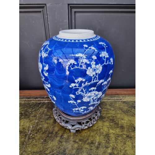 1670 - A large Chinese blue and white jar, 28cm high, on hardwood stand. 