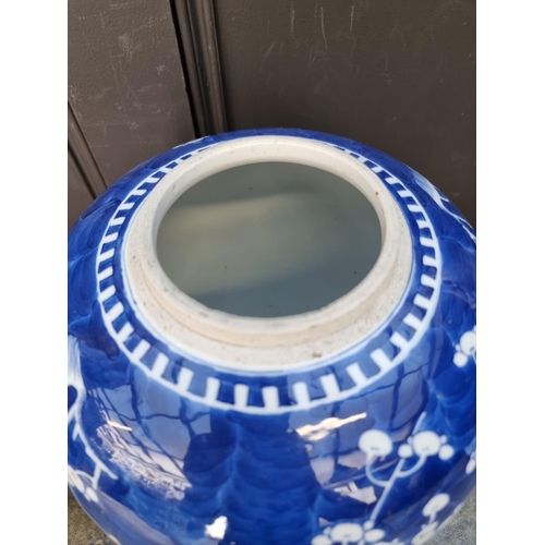 1670 - A large Chinese blue and white jar, 28cm high, on hardwood stand. 