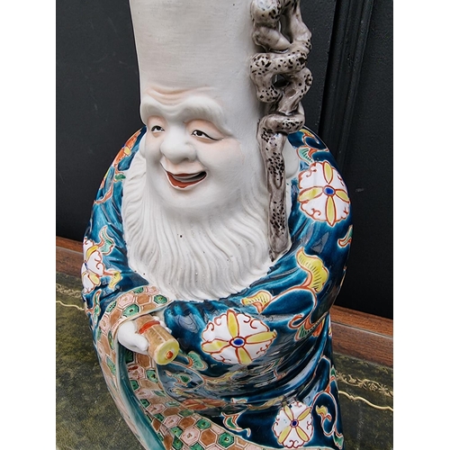 1671 - A large Japanese Kutani porcelain figure of Fukurokuju, 39cm high, (s.d).