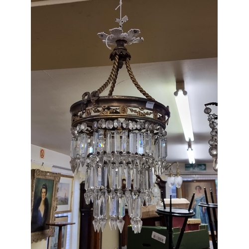 1678 - Two antique brass and facetted glass chandeliers, largest 65cm high.