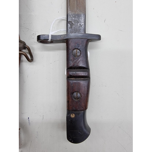 1708 - A World War I US bayonet with scabbard and frog, by Remington, stamped '1917', with 43cm blade; toge... 