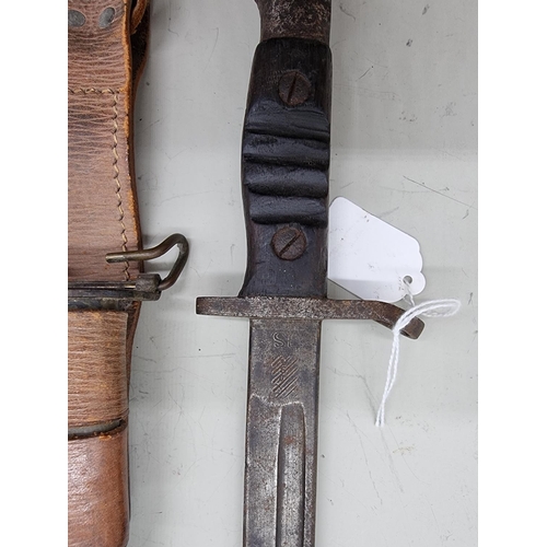 1708 - A World War I US bayonet with scabbard and frog, by Remington, stamped '1917', with 43cm blade; toge... 