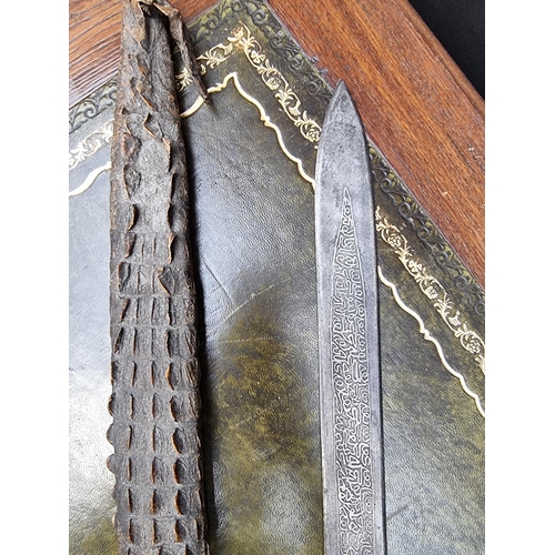 1714 - A Sudanese Mahdist Kaskara sword and crocodile scabbard, with etched 87cm blade, (loss to upper jaw)... 