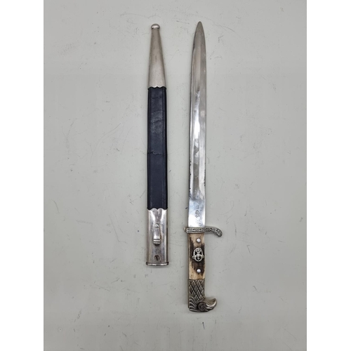 1715 - A German World War II police bayonet and scabbard, by Weyersburg Kirschbaum & Cie Solingen, with... 