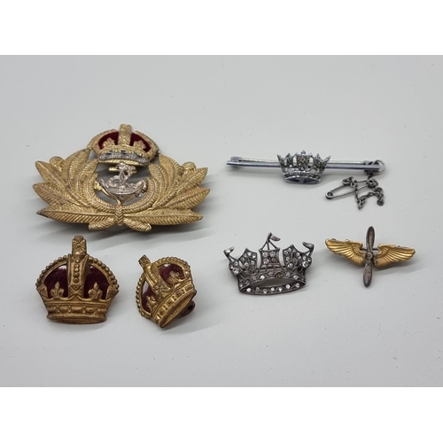 1732 - A small group of navy and military brooches, badges and similar. (6)