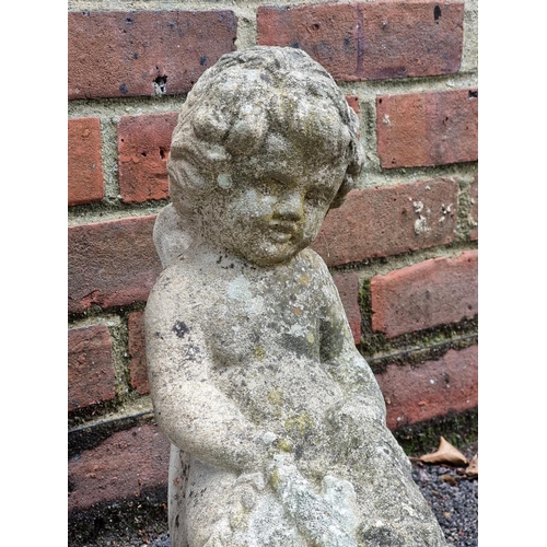 1733 - An old weathered composition stone cherub and shell water feature, 71cm high; together with ano... 