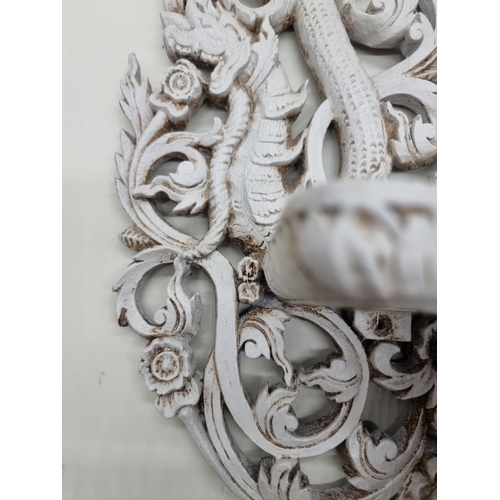 1735 - An Indonesian grey painted carved wood wall bracket, 58cm high. 