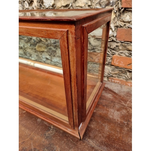 1744 - A large stained wood display case, 41cm high x 133cm wide x 35cm deep.