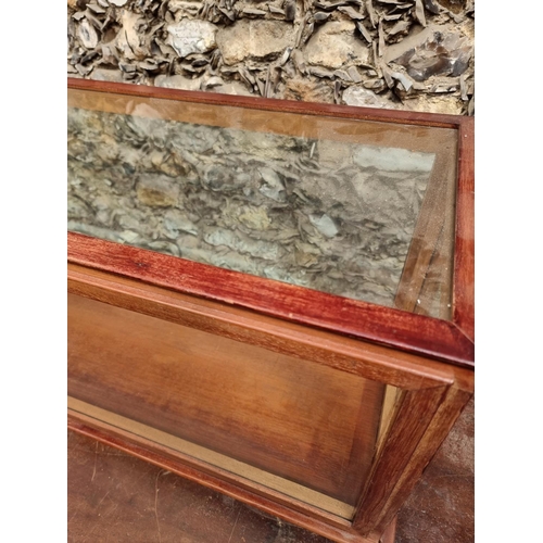 1744 - A large stained wood display case, 41cm high x 133cm wide x 35cm deep.