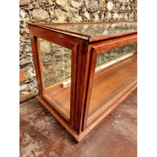 1744 - A large stained wood display case, 41cm high x 133cm wide x 35cm deep.