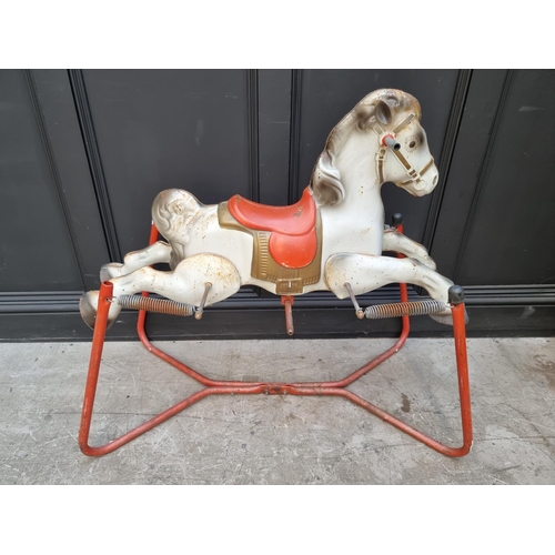 1746 - A vintage tinplate child's sprung rocking horse, 89cm high; together with another push along plush d... 