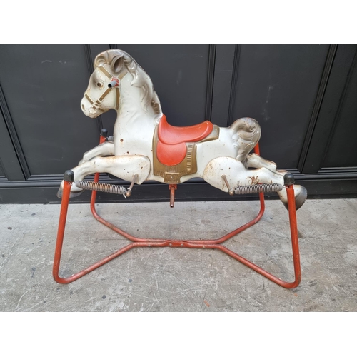 1746 - A vintage tinplate child's sprung rocking horse, 89cm high; together with another push along plush d... 