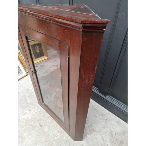 1749 - A mahogany hanging corner display cupboard, 111 x 78.5cm.