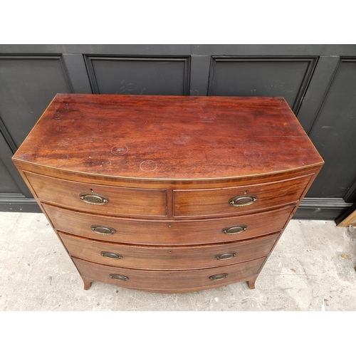 1762 - An early 19th century mahogany and line inlaid bowfront chest of drawers, 106cm wide. ... 