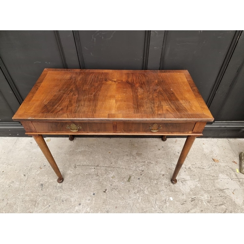 1763 - An Edwardian mahogany two drawer side table, 106cm wide. 