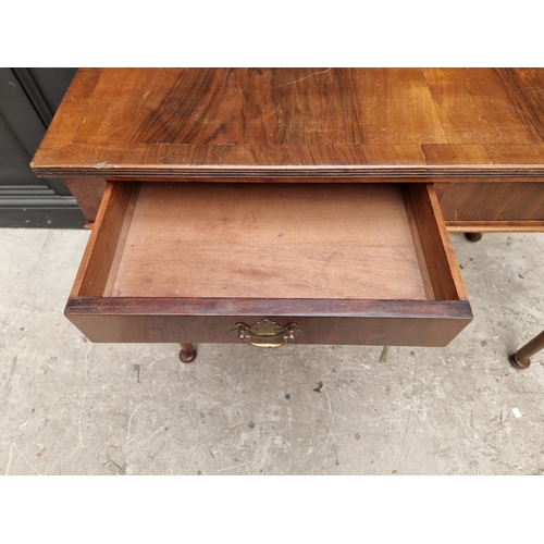 1763 - An Edwardian mahogany two drawer side table, 106cm wide. 