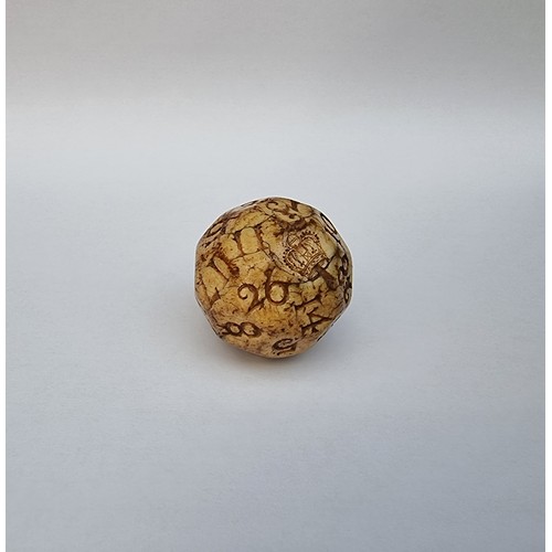 1631 - A rare late 17th century carved walrus ivory lottery or teetotum gaming ball, with 32 facetted and n... 