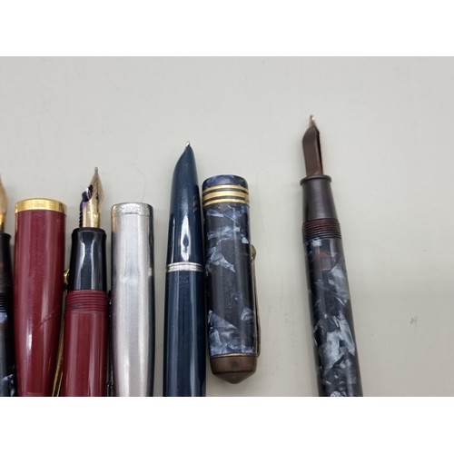 1621 - Eight various pens, two with 14k nibs.