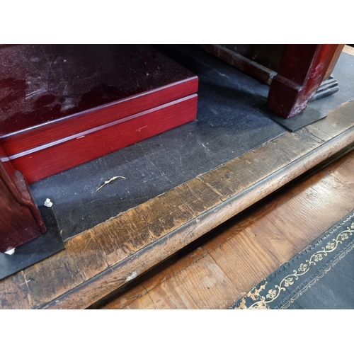 1044 - A large Victorian oak desk, 135.5cm wide.