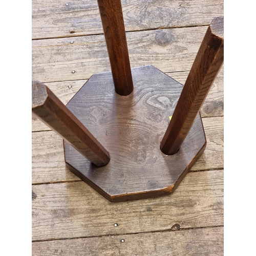 1063 - An antique elm and oak octagonal milking stool, 26.5cm wide.  