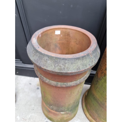 1348 - Four various terracotta chimney pots, largest 76cm high. 