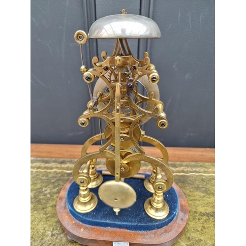 1411 - A skeleton clock, with glass dome, total height 38.5cm high, with pendulum, (lacking hour hand)... 