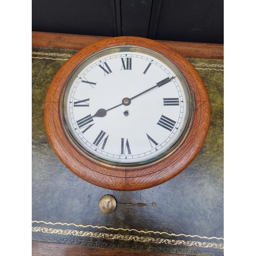 1689 - An oak wall clock, with 11 3/4in painted dial, and pendulum.