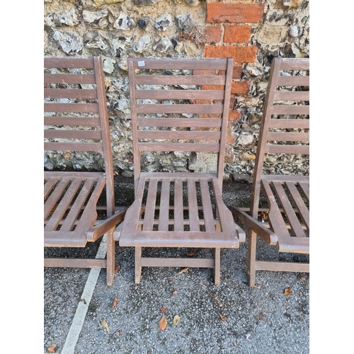 1737 - A set of four folding hardwood garden chairs.