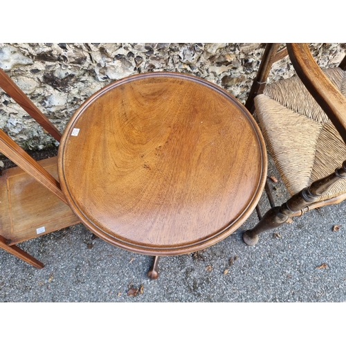 1765 - An antique mahogany circular tripod table, 55cm diameter, (reduced in height); together with an... 