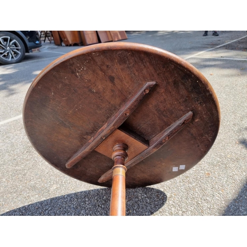 1765 - An antique mahogany circular tripod table, 55cm diameter, (reduced in height); together with an... 