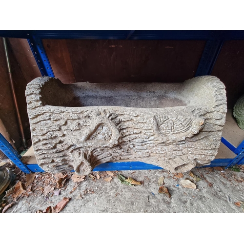 1771 - A pair of reconstituted stone log form planters; together with a circular planter.